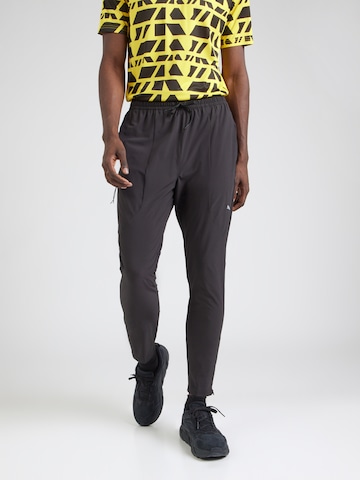 PUMA Tapered Sportbroek 'FLEX' in Zwart: voorkant
