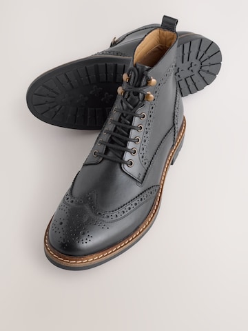 Boots stringati di Next in nero