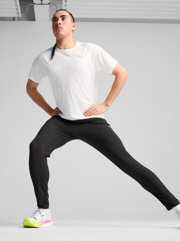 PUMA - Tapered Pantalón deportivo 'Velocity' en negro
