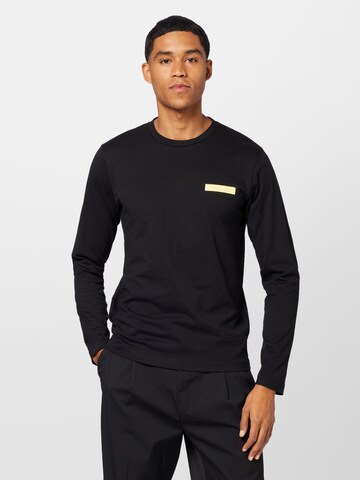 Calvin Klein - Camiseta en negro: frente