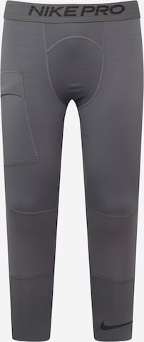 NIKE Skinny Workout Pants in Grey: front