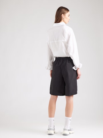 Nike Sportswear - regular Pantalón plisado 'EVRYTHNG' en negro