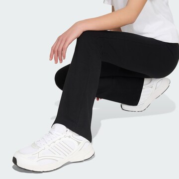Flared Pantaloni sportivi 'Essentials' di ADIDAS SPORTSWEAR in nero