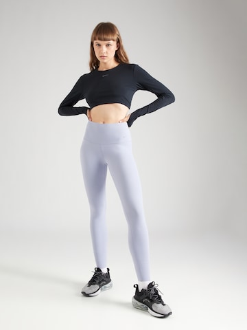 NIKE - Skinny Calças de desporto 'ZENVY' em roxo