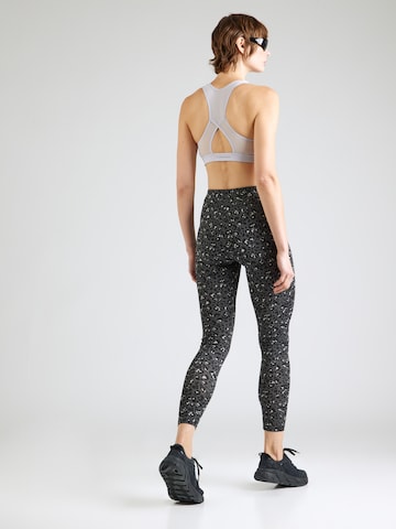 PUMA Skinny Urheiluhousut 'Essentials' värissä musta