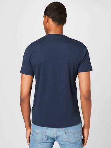 Calvin Klein قميص بلون أزرق