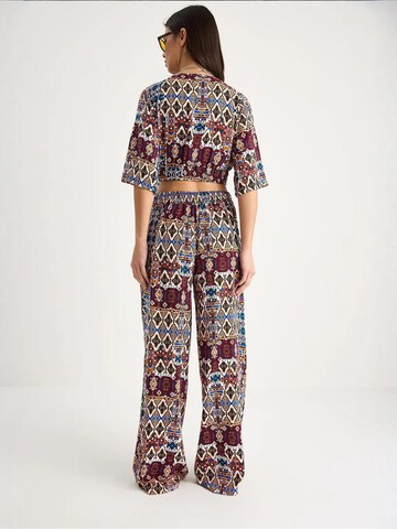 Completo pantalone di Bianco Lucci in rosso