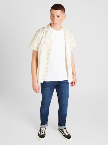 Tommy Jeans Koszulka w kolorze beżowy