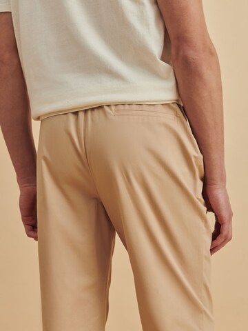 DAN FOX APPAREL Tapered Pants 'Julian' in Beige