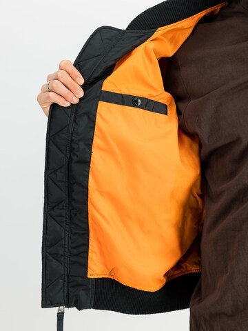Veste mi-saison 'Flying Tigers' ALPHA INDUSTRIES en noir