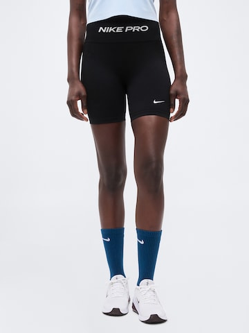 Skinny Pantaloni sport 'Seamless' de la NIKE pe negru: față