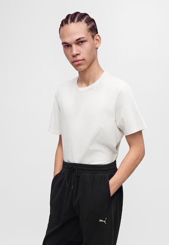 PUMA Loose fit Trousers 'Essential' in Black
