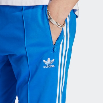 mėlyna ADIDAS ORIGINALS Prigludęs Kelnės 'Adicolor Classics Beckenbauer'