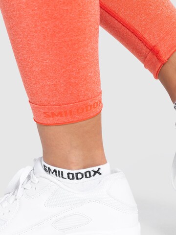 Smilodox Skinny Workout Pants 'Amaze Pro' in Orange