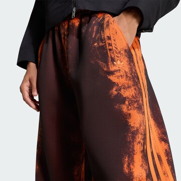 ADIDAS ORIGINALSWide Leg/ Široke nogavice Hlače 'Adilenium 6' - narančasta boja
