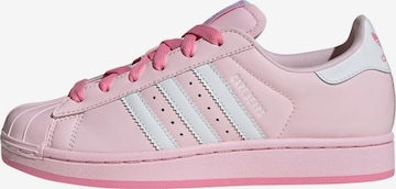 ADIDAS ORIGINALSNiske tenisice 'Care Bears X Adidas Superstar II' - roza boja: prednji dio