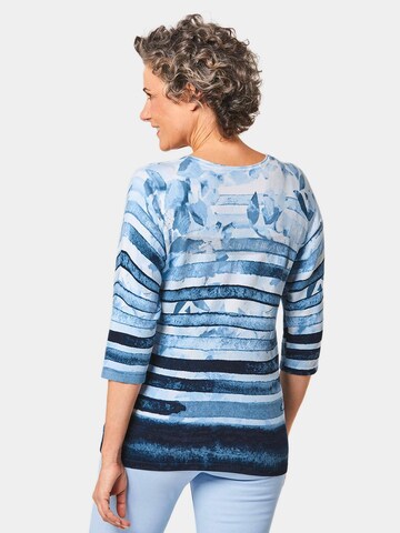 Goldner Pullover in Blau