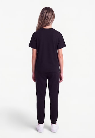 Nike Sportswear - Camiseta en negro: atrás