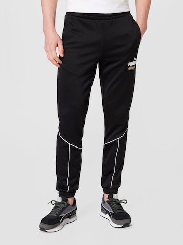 Effilé Pantalon de sport 'King' PUMA en noir : devant