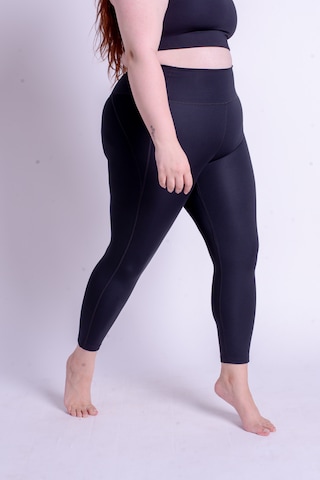Girlfriend Collective Skinny Workout Pants in Black: front