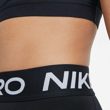 NIKE Skinny Športne hlače | črna barva