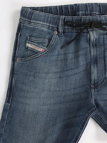 DIESEL Tapered Jeans '2030 D-KROOLEY JOGGJEANS Superstretch & Supersoft' in Green