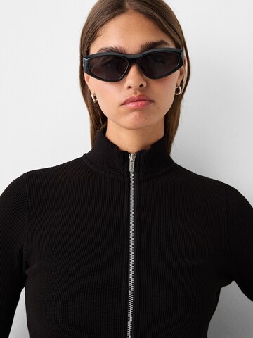 Bershka Sunglasses in Black: front