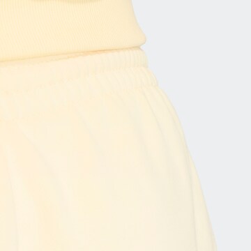 ADIDAS ORIGINALS Loose fit Pants 'Essential' in Yellow