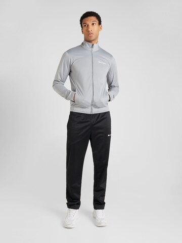 Champion Authentic Athletic Apparel Tracksuit in Grey: front