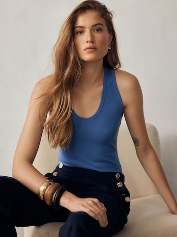 Next - Top en azul: frente