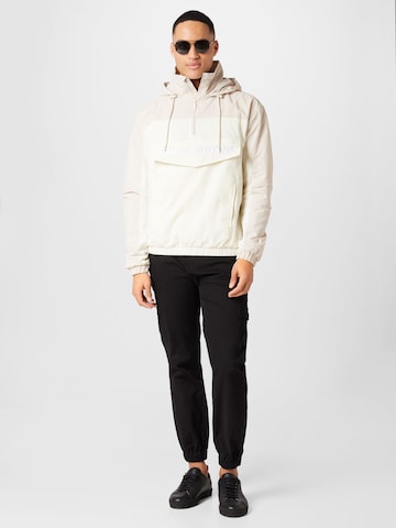 Karl Kani Between-season jacket in Beige