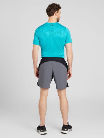 UNDER ARMOUR Regular Sportbroek 'Peak Woven Hybrid' in Zwart