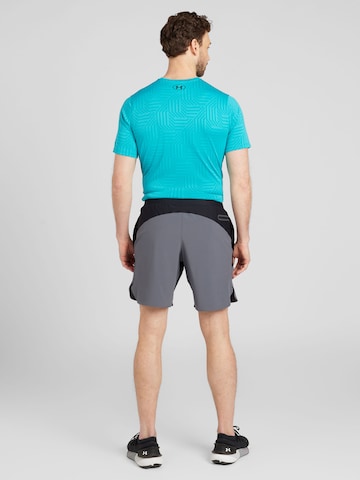 UNDER ARMOUR Regular Sportshorts 'Peak Woven Hybrid' in Schwarz