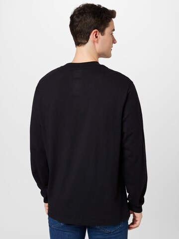 HUGO - Camiseta 'Dotopaxi' en negro