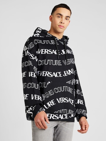 Versace Jeans CoutureSweater majica - crna boja: prednji dio