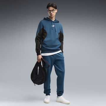 PUMA Sportsweatshirt 'Essentials' in Blauw