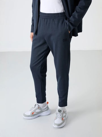 Tommy Life Trainingspak 'Aktive Sets' in Grijs