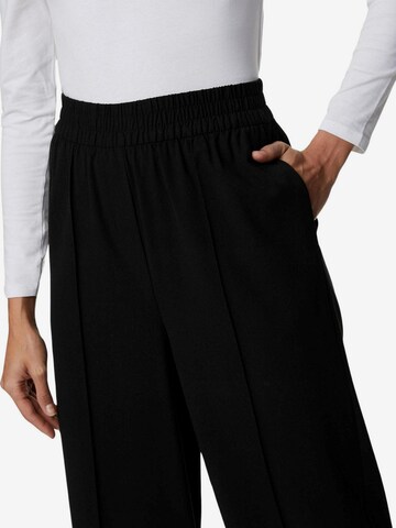 Wide leg Pantaloni con piega frontale di Marks & Spencer in nero