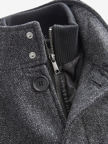 Next Prehoden plašč | črna barva