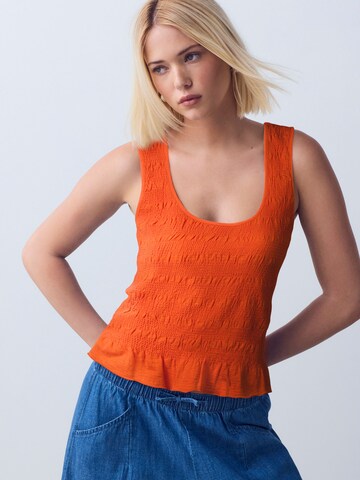 Top di Next in arancione: frontale