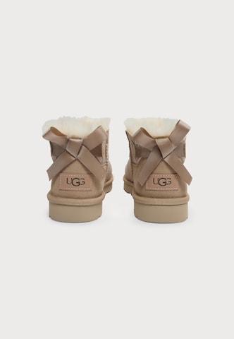 bēšs UGG Klasiski zābaki 'Ultra Mini Bailey Bow'