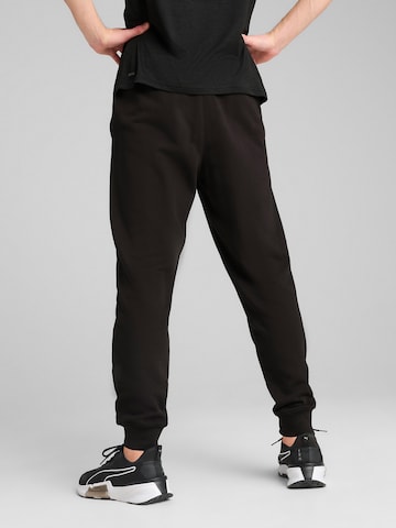 PUMA Конический (Tapered) Спортивные штаны 'Tad Essentials' в Черный