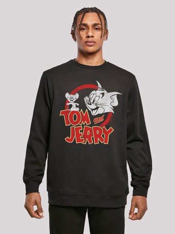 F4NT4STIC Sweatshirt 'Tom And Jerry Distressed' in Black: front