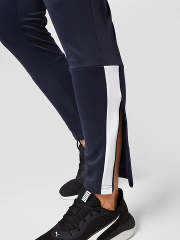PUMA Tapered Sports trousers in Blue