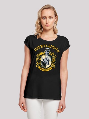 Maglietta 'Harry Potter Hufflepuff Crest' di F4NT4STIC in nero: frontale