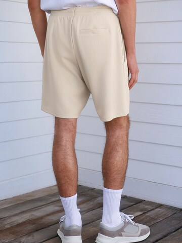 regular Pantaloni di Next in beige