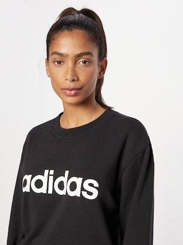 ADIDAS SPORTSWEAR Αθλητική μπλούζα φούτερ 'Essentials Linear' σε μαύρο