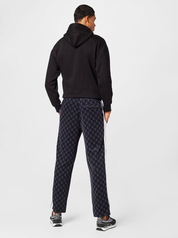 Regular Pantaloni de la PUMA pe negru