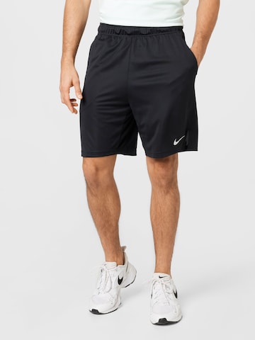 NIKE Regular Workout Pants in Black: front