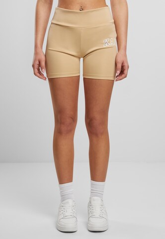 Skinny Pantaloni sportivi di Karl Kani in beige